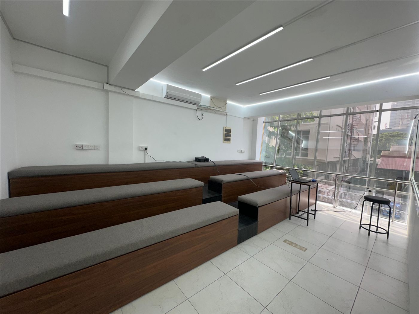 Tiered lounge seating in a naturally lit space at the ILT campus